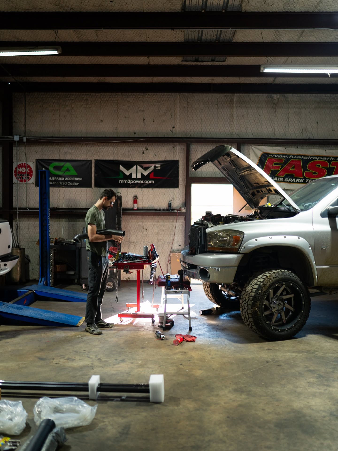 Tech working on a lifted Cummins