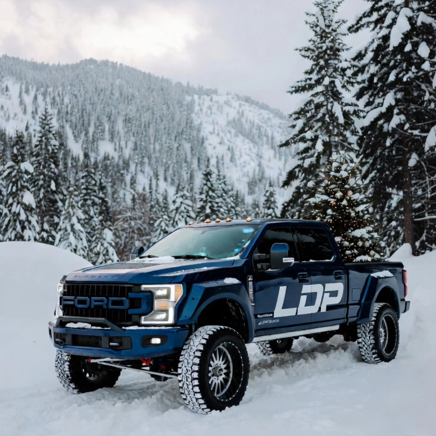 Lifted blue LDP Super Duty in the snow